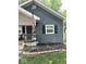 Charming home featuring a cozy porch, updated siding, and meticulous landscaping for enhanced curb appeal at 3308 Schofield Ne Ave, Indianapolis, IN 46218