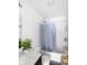 Bathroom features tub with shower, toilet, and sink with natural lighting at 3432 Shepperton Blvd, Indianapolis, IN 46228