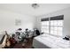 Well-lit bedroom features hardwood floors, with drums and keyboard at 3432 Shepperton Blvd, Indianapolis, IN 46228