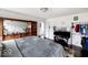 Bedroom featuring natural lighting, hardwood floors, and a large dresser at 3432 Shepperton Blvd, Indianapolis, IN 46228