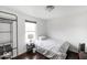 Cozy bedroom with natural lighting, hardwood floors, and a simple design at 3432 Shepperton Blvd, Indianapolis, IN 46228