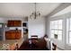 Sunlit dining area with wood table and a view from the bright window at 3432 Shepperton Blvd, Indianapolis, IN 46228