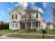 Attractive two-story home with well-maintained lawn and classic architectural details at 3432 Shepperton Blvd, Indianapolis, IN 46228