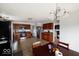 Open kitchen with stainless steel appliances and adjacent dining area with natural light at 3432 Shepperton Blvd, Indianapolis, IN 46228