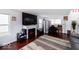 Comfortable living room features a fireplace and hardwood floors at 3432 Shepperton Blvd, Indianapolis, IN 46228
