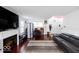 Bright living room features a fireplace, hardwood floors, and ample natural light at 3432 Shepperton Blvd, Indianapolis, IN 46228