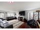 Open-concept living room with cozy fireplace, hardwood floors, and ample seating at 3432 Shepperton Blvd, Indianapolis, IN 46228