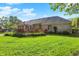 Enjoy the spacious backyard with a wooden deck attached to the brick house at 37 Trotters Run, Brownsburg, IN 46112