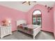 Cozy pink bedroom with vaulted ceiling, arched window and carpet floor at 37 Trotters Run, Brownsburg, IN 46112