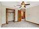 This bedroom offers carpet, baseboard trim, and doors to the hall and closet at 37 Trotters Run, Brownsburg, IN 46112
