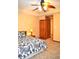 Bedroom with a bed with patterned bedspread, carpet, neutral paint and a ceiling fan at 37 Trotters Run, Brownsburg, IN 46112