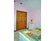 Bedroom featuring a double door closet, a white nightstand and pink walls at 37 Trotters Run, Brownsburg, IN 46112