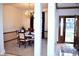 Inviting dining room with elegant chandelier, carpeted floor, and a clear view of the front door at 37 Trotters Run, Brownsburg, IN 46112