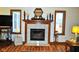 Cozy living room showcasing a charming fireplace with decorative mantle and classic tile surround at 37 Trotters Run, Brownsburg, IN 46112