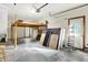Garage with storage loft, work bench, and door to the exterior at 37 Trotters Run, Brownsburg, IN 46112