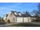Side view of the home showing a spacious three-car garage and a basketball hoop at 37 Trotters Run, Brownsburg, IN 46112
