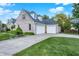 Spacious two-car garage with a concrete driveway and a basketball hoop for outdoor fun at 37 Trotters Run, Brownsburg, IN 46112