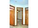 Hallway featuring wood doors, neutral carpet and a ceiling fan visible through the open doorway at 37 Trotters Run, Brownsburg, IN 46112