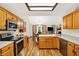 Spacious eat-in kitchen features stainless appliances, wood cabinets and a light-filled dining nook at 37 Trotters Run, Brownsburg, IN 46112