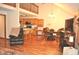 Open-concept living area with hardwood floors, a kitchen island, and a dining space at 37 Trotters Run, Brownsburg, IN 46112