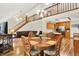 Open-concept living space featuring hardwood floors, second story access, and a view into the kitchen at 37 Trotters Run, Brownsburg, IN 46112
