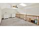 Loft area featuring carpeted floors, railing, and two access doors at 37 Trotters Run, Brownsburg, IN 46112