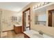 Bright bathroom with double sinks, tile floor, and separate shower and tub at 37 Trotters Run, Brownsburg, IN 46112
