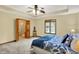 Spacious bedroom with neutral walls, carpet flooring, and ensuite bathroom at 37 Trotters Run, Brownsburg, IN 46112