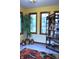 Bright sunroom with tile floors, yellow walls, a plant and windows offering lots of natural light at 37 Trotters Run, Brownsburg, IN 46112