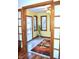 Bright sunroom with white tile flooring, many windows, a ceiling fan and sliding glass doors at 37 Trotters Run, Brownsburg, IN 46112