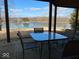 Covered patio with a dining table overlooking the picturesque water view at 3752 W North Wood Lake Dr, Columbus, IN 47201