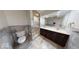 Modern bathroom featuring a double sink vanity, tiled shower, and contemporary fixtures at 3752 W North Wood Lake Dr, Columbus, IN 47201