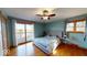 Serene bedroom featuring hardwood floors, calming wall color, and an outdoor deck at 3752 W North Wood Lake Dr, Columbus, IN 47201