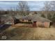 Brick home with a side entry garage and a large yard overlooking a lake at 3752 W North Wood Lake Dr, Columbus, IN 47201