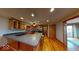 Spacious kitchen with stainless steel appliances, lots of wood cabinets, and an island with seating at 3752 W North Wood Lake Dr, Columbus, IN 47201