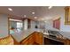 Open kitchen with gas range stove and spacious countertops, flowing into the dining and living spaces at 3752 W North Wood Lake Dr, Columbus, IN 47201