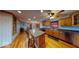 Well-lit kitchen features an island with seating, hardwood floors, and modern appliances at 3752 W North Wood Lake Dr, Columbus, IN 47201