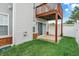 Charming backyard view featuring a patio with sliding doors, a balcony, and a privacy fence at 451 Filmore Dr, Westfield, IN 46074