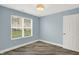 Cozy bedroom with natural light from a window and stylish wood-look floors at 451 Filmore Dr, Westfield, IN 46074