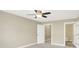 Bright bedroom with carpet flooring featuring a walk-in closet and connecting bathroom at 451 Filmore Dr, Westfield, IN 46074
