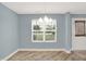 Inviting dining room featuring modern lighting and serene blue walls at 451 Filmore Dr, Westfield, IN 46074