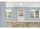 Bright entryway featuring wood-look flooring and a stylish front door at 451 Filmore Dr, Westfield, IN 46074