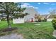 Charming two-story home with a well-manicured lawn, mature tree, and inviting curb appeal at 451 Filmore Dr, Westfield, IN 46074