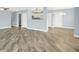 Open concept living space with modern gray plank flooring and soothing pale blue walls at 451 Filmore Dr, Westfield, IN 46074