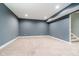 Spacious carpeted basement with neutral walls and recessed lighting, ready for customization at 5032 N Illinois St, Indianapolis, IN 46208