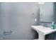 Bathroom with grey walls, chrome towel rack, and vanity at 5032 N Illinois St, Indianapolis, IN 46208