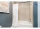 Bathroom features a tiled shower and tub with a neutral color scheme at 5032 N Illinois St, Indianapolis, IN 46208