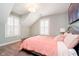Bedroom with plush carpeting, window shutters, and a bed at 5032 N Illinois St, Indianapolis, IN 46208