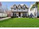 Charming two-story home with a well-manicured lawn and a welcoming front porch, perfect for relaxing outdoors at 5032 N Illinois St, Indianapolis, IN 46208