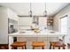 Beautiful kitchen features a large island, stainless steel appliances, and stylish lighting, perfect for entertaining at 5032 N Illinois St, Indianapolis, IN 46208